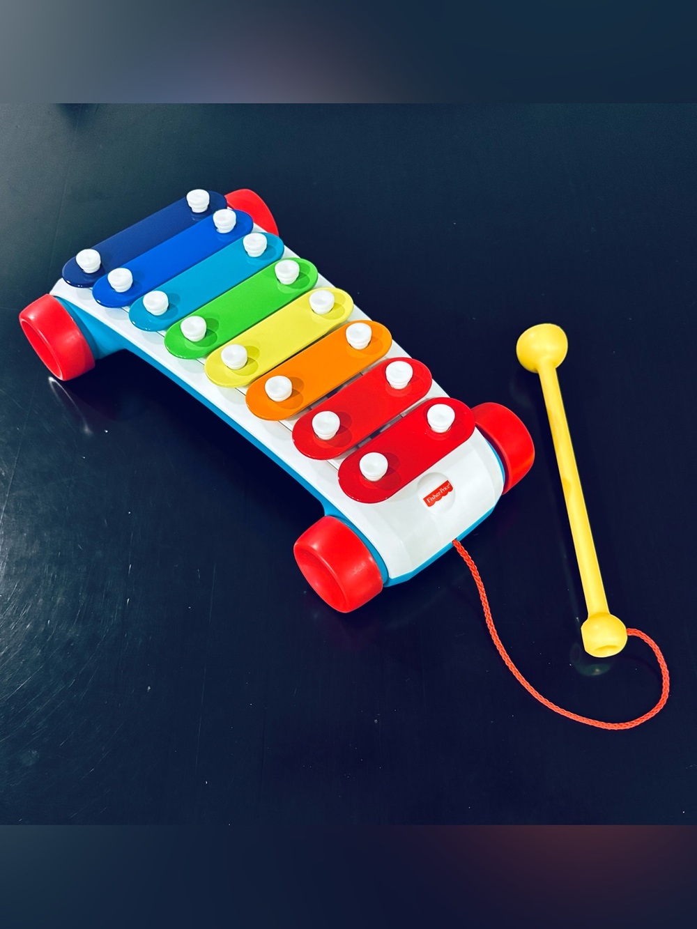 Fisher-Price Pull-Along Rainbow Xylophone Musical Toy on Wheels with Mallet